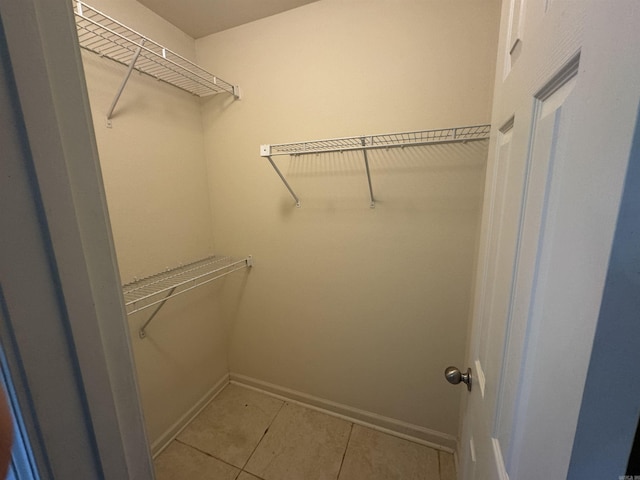 1010 Tori Ln, Beebe, AR 72012 - walk in closet with light tile patterned flooring