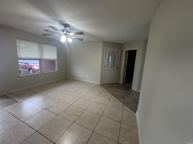 1010 Tori Ln, Beebe, AR 72012 - empty room with light tile patterned flooring and a ceiling fan