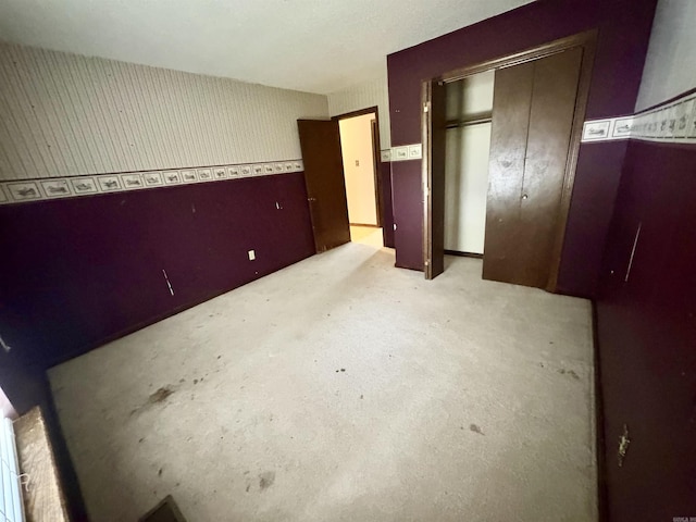 unfurnished bedroom with a closet