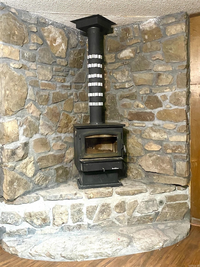 detailed view of a wood stove and wood finished floors