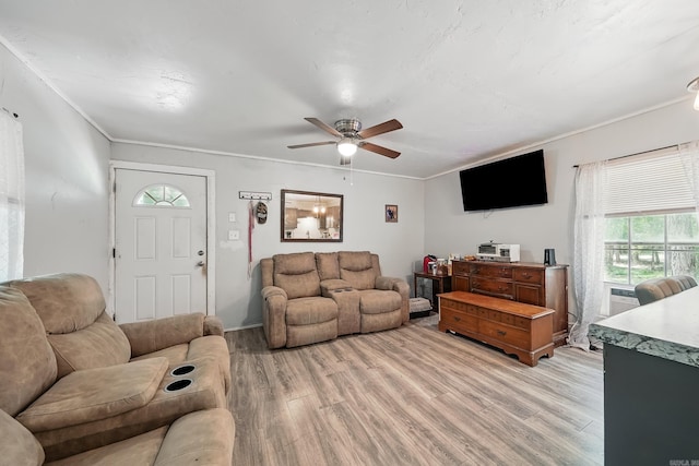172 Susie Ln, Mena, AR 71953 - living area with light wood-style floors, ceiling fan, and ornamental molding