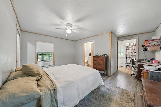 172 Susie Ln, Mena, AR 71953 - bedroom with light wood-style floors, multiple windows, ensuite bathroom, and a ceiling fan