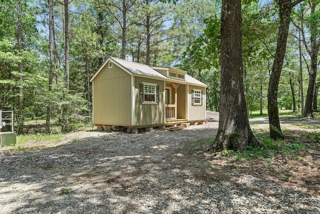 172 Susie Ln, Mena, AR 71953 - view of front of property with an outbuilding and a metal roof