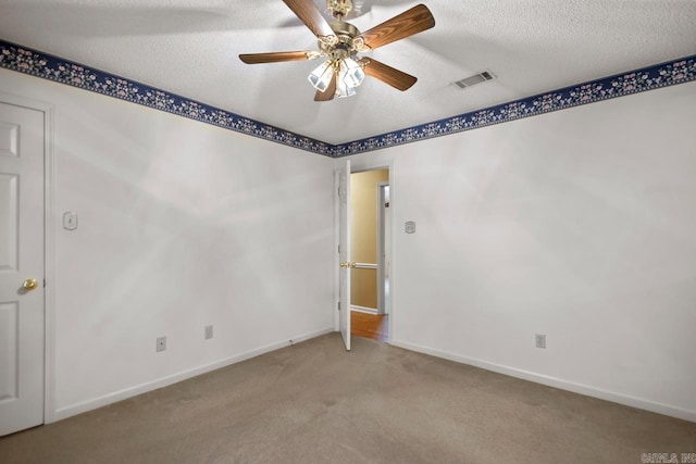 3905 Deer Dr, Benton, AR 72019 - unfurnished room with light colored carpet, a ceiling fan, and a textured ceiling