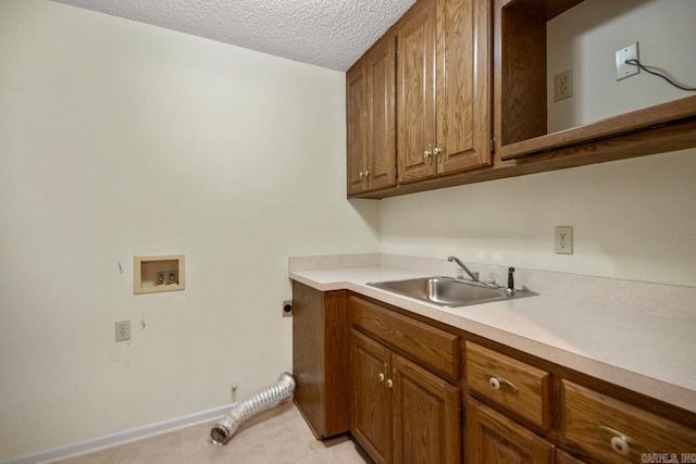3905 Deer Dr, Benton, AR 72019 - laundry room featuring hookup for an electric dryer, washer hookup, cabinet space, and a textured ceiling