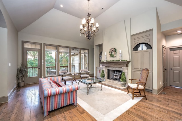 12 Cobblestone Way, Little Rock, AR 72223 - living area featuring high vaulted ceiling, a chandelier, hardwood / wood-style floors, a fireplace, and recessed lighting