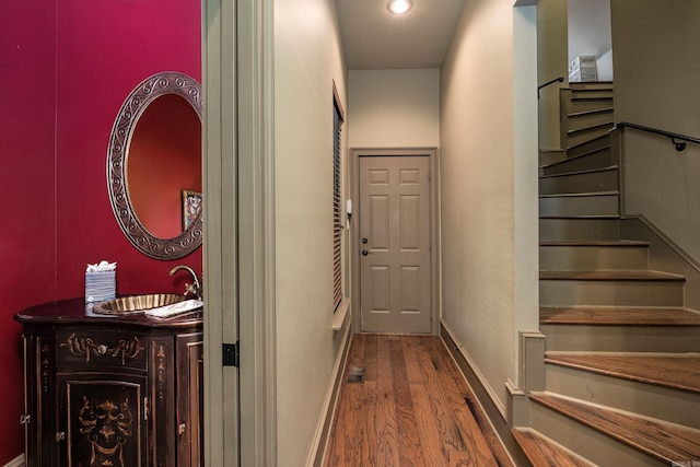 12 Cobblestone Way, Little Rock, AR 72223 - corridor featuring wood finished floors and stairway