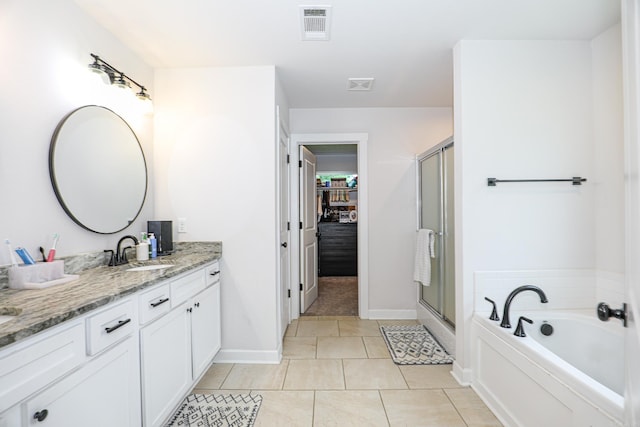 2072 Creekwood Cir, Bauxite, AR 72011 - bathroom featuring double vanity, a stall shower, a bath, and tile patterned flooring