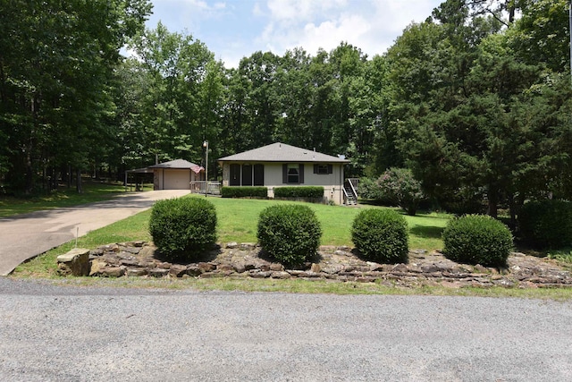 230 Spring St, Fairfield Bay, AR 72088 - view of front of house featuring a front yard, concrete driveway, stairway, and a carport