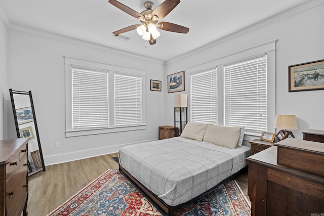 100 Melrose Dv, North Little Rock, AR 72114 - bedroom with wood finished floors, crown molding, ceiling fan, and multiple windows