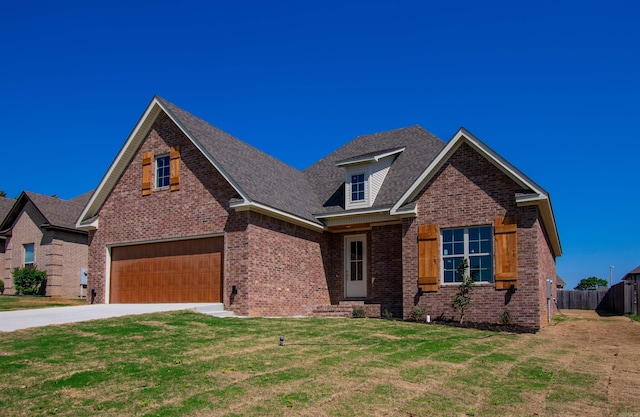 2284 Sistine Chapel Cir, Jonesboro, AR 72404 - view of front of home with a garage, brick siding, concrete driveway, and a shingled roof