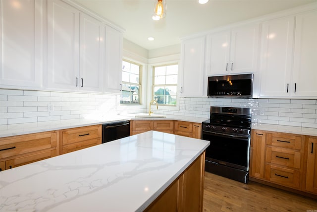 2284 Sistine Chapel Cir, Jonesboro, AR 72404 - kitchen featuring black appliances, light stone counters, backsplash, and recessed lighting
