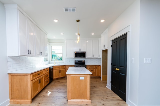 2284 Sistine Chapel Cir, Jonesboro, AR 72404 - kitchen featuring stainless steel appliances, light wood-style floors, decorative backsplash, and recessed lighting