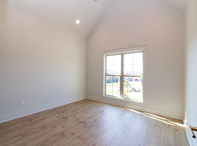 2284 Sistine Chapel Cir, Jonesboro, AR 72404 - empty room with wood finished floors, high vaulted ceiling, and recessed lighting