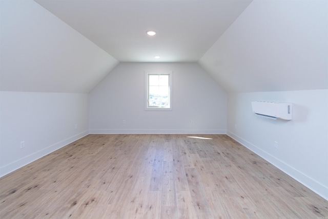 2284 Sistine Chapel Cir, Jonesboro, AR 72404 - bonus room with a wall mounted AC, lofted ceiling, and light wood-style flooring