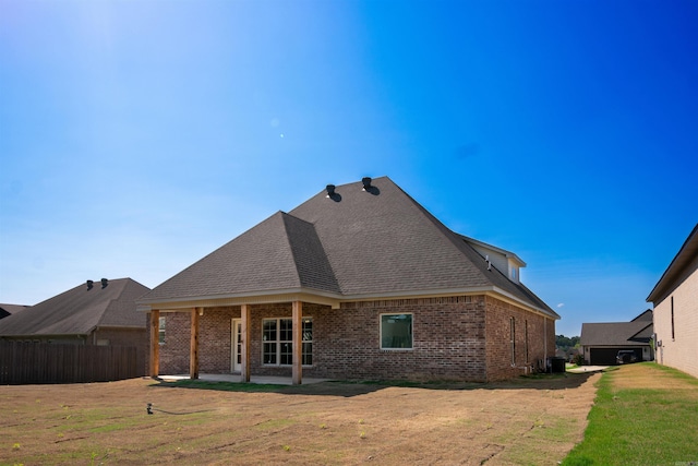 2284 Sistine Chapel Cir, Jonesboro, AR 72404 - back of house with brick siding, a patio, and a shingled roof