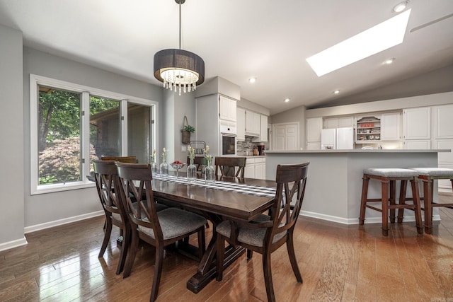 96 San Sebastian Way, Hot Springs Village, AR 71909 - dining room featuring wood-type flooring, a skylight, a chandelier, lofted ceiling, and recessed lighting