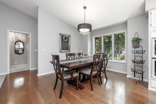 96 San Sebastian Way, Hot Springs Village, AR 71909 - dining area featuring wood-type flooring and lofted ceiling