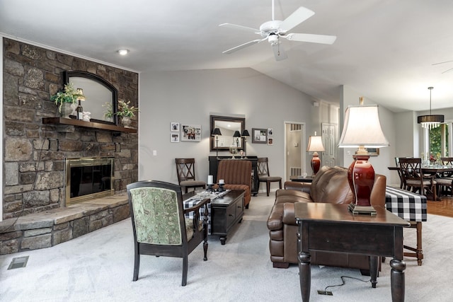 96 San Sebastian Way, Hot Springs Village, AR 71909 - carpeted living room featuring a ceiling fan, a stone fireplace, and lofted ceiling