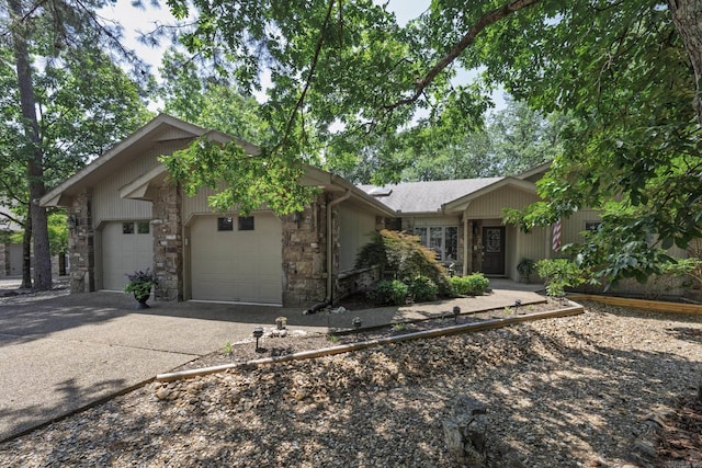 96 San Sebastian Way, Hot Springs Village, AR 71909 - view of front of home featuring a garage, stone siding, and asphalt driveway