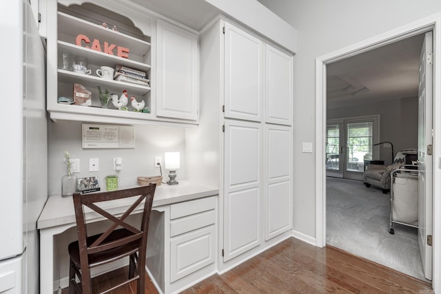 96 San Sebastian Way, Hot Springs Village, AR 71909 - bar featuring built in study area and dark wood finished floors