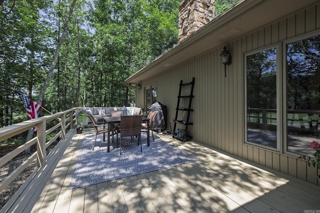 96 San Sebastian Way, Hot Springs Village, AR 71909 - wooden terrace with outdoor dining area