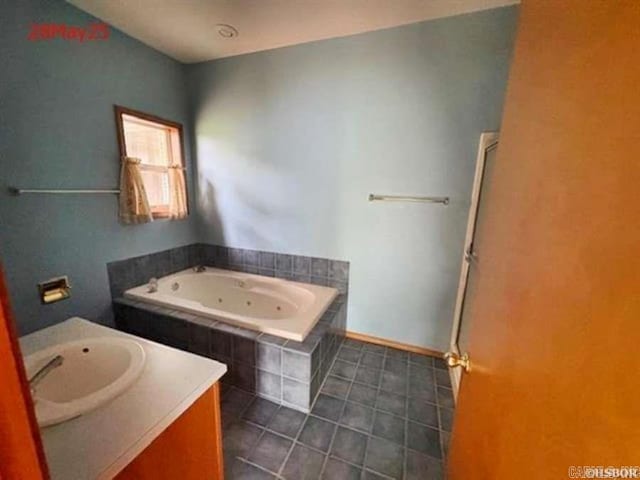 1116 Mccracken Ridge Rd, Mountain Home, AR 72653 - full bath featuring a whirlpool tub, vanity, and tile patterned floors