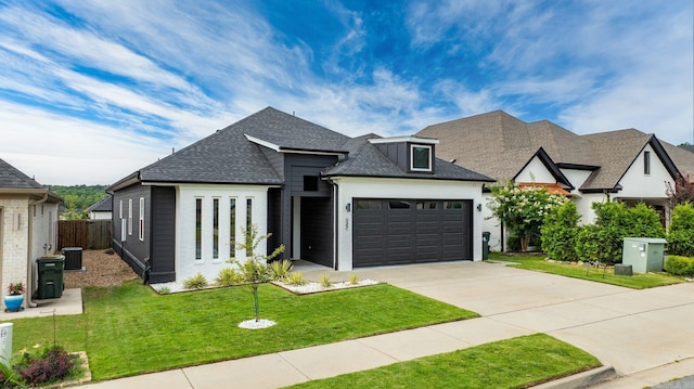 127 Copper Cir, Little Rock, AR 72223 - french country inspired facade with an attached garage, driveway, and a shingled roof