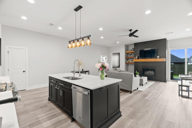 127 Copper Cir, Little Rock, AR 72223 - kitchen featuring stainless steel dishwasher, dark cabinets, light wood-style floors, a ceiling fan, and light countertops