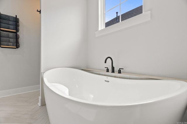 127 Copper Cir, Little Rock, AR 72223 - bathroom featuring a soaking tub and baseboards