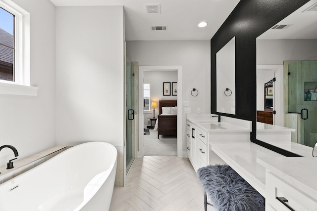 127 Copper Cir, Little Rock, AR 72223 - full bath featuring vanity, a stall shower, a freestanding bath, and recessed lighting