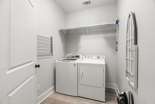 127 Copper Cir, Little Rock, AR 72223 - washroom featuring washer and dryer and light wood-style flooring