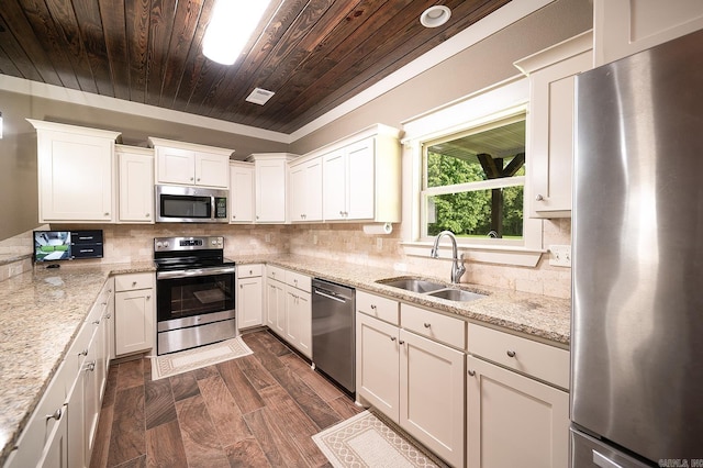 241 Sandy Creek Dr, Ward, AR 72176 - kitchen with appliances with stainless steel finishes, wood ceiling, white cabinets, light stone countertops, and backsplash