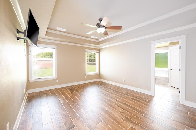 241 Sandy Creek Dr, Ward, AR 72176 - empty room featuring a raised ceiling, wood finished floors, a ceiling fan, and ornamental molding