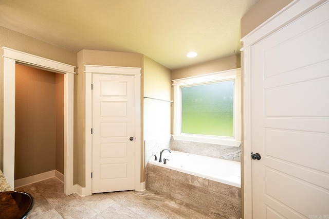 241 Sandy Creek Dr, Ward, AR 72176 - bathroom with a bath and tile patterned flooring