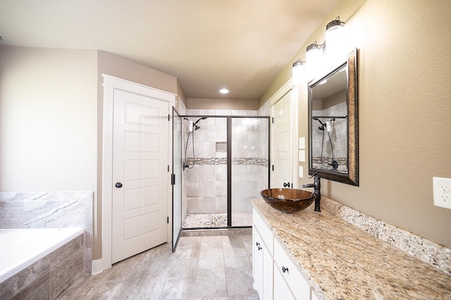 241 Sandy Creek Dr, Ward, AR 72176 - full bath with a stall shower, vanity, a bath, and recessed lighting