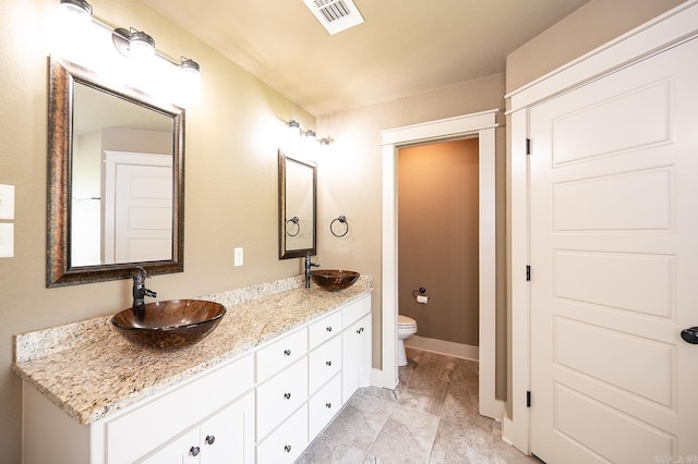 241 Sandy Creek Dr, Ward, AR 72176 - bathroom featuring double vanity and toilet