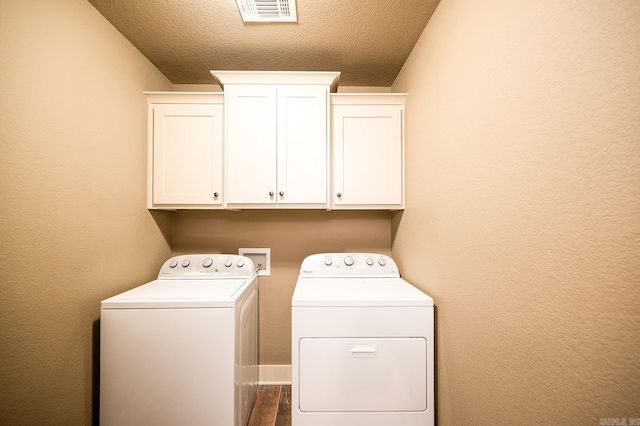 241 Sandy Creek Dr, Ward, AR 72176 - laundry area featuring washer and dryer, cabinet space, and dark wood-type flooring