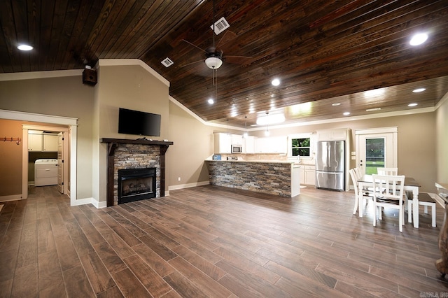 241 Sandy Creek Dr, Ward, AR 72176 - living room featuring wooden ceiling, ceiling fan, a stone fireplace, vaulted ceiling, and dark wood-style floors