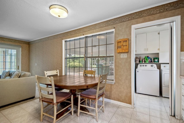 11414 E Stoney Point Ct, Little Rock, AR 72211 - dining area featuring washer and dryer, wallpapered walls, crown molding, plenty of natural light, and light tile patterned floors