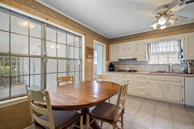 11414 E Stoney Point Ct, Little Rock, AR 72211 - dining room with a ceiling fan, light tile patterned floors, and crown molding