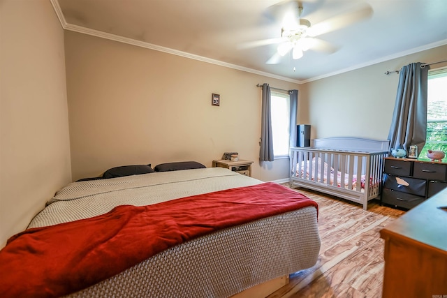 3215 Edgewood Rd, El Dorado, AR 71730 - bedroom featuring wood finished floors, ornamental molding, and ceiling fan