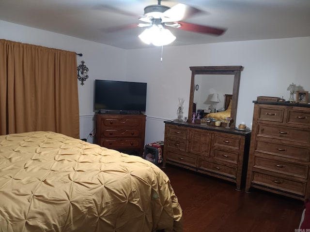 1402 Holmes Rd, Searcy, AR 72143 - bedroom with dark wood-style floors and a ceiling fan