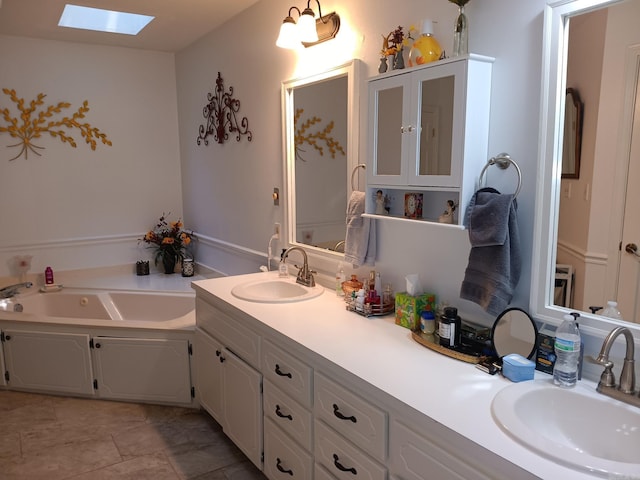 1402 Holmes Rd, Searcy, AR 72143 - bathroom featuring a skylight, double vanity, and a garden tub