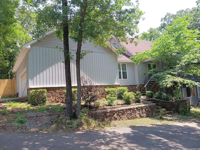1402 Holmes Rd, Searcy, AR 72143 - view of side of home featuring stairs