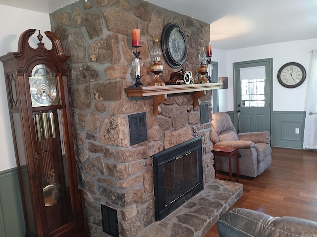 1402 Holmes Rd, Searcy, AR 72143 - living room with a fireplace, a wainscoted wall, and wood finished floors