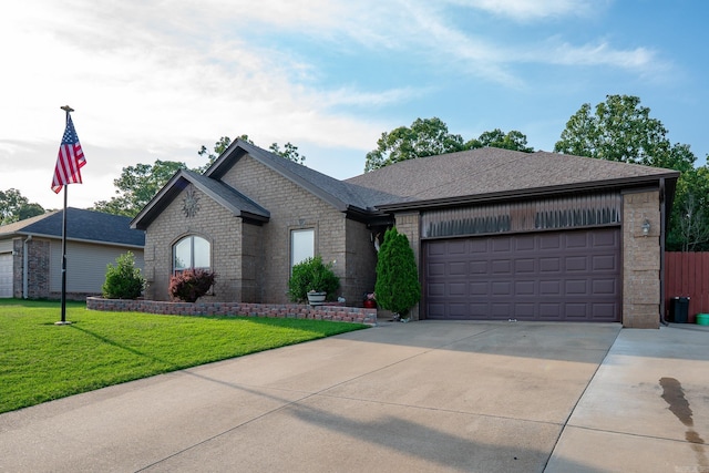 344 Austin Creek Dr, Austin, AR 72007 - view of front facade with concrete driveway, brick siding, a garage, a front yard, and roof with shingles