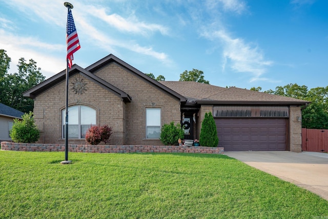 344 Austin Creek Dr, Austin, AR 72007 - view of front of home featuring concrete driveway, a garage, a front yard, brick siding, and a shingled roof