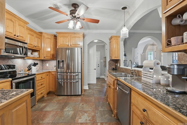 3051 Mount Mcgregor Dr, Benton, AR 72019 - kitchen featuring appliances with stainless steel finishes, arched walkways, a ceiling fan, tile countertops, and crown molding