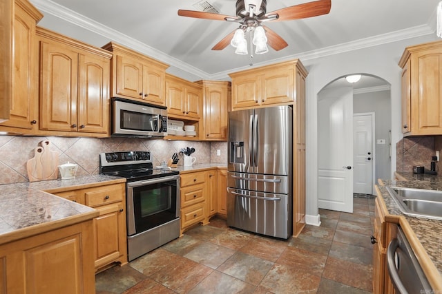3051 Mount Mcgregor Dr, Benton, AR 72019 - kitchen featuring stainless steel appliances, arched walkways, ornamental molding, ceiling fan, and tile countertops